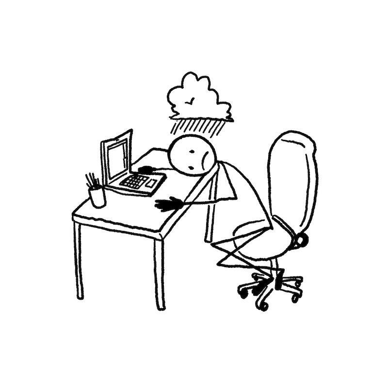Stick figure with head on a desk with computer. Figure has a cloud over its head